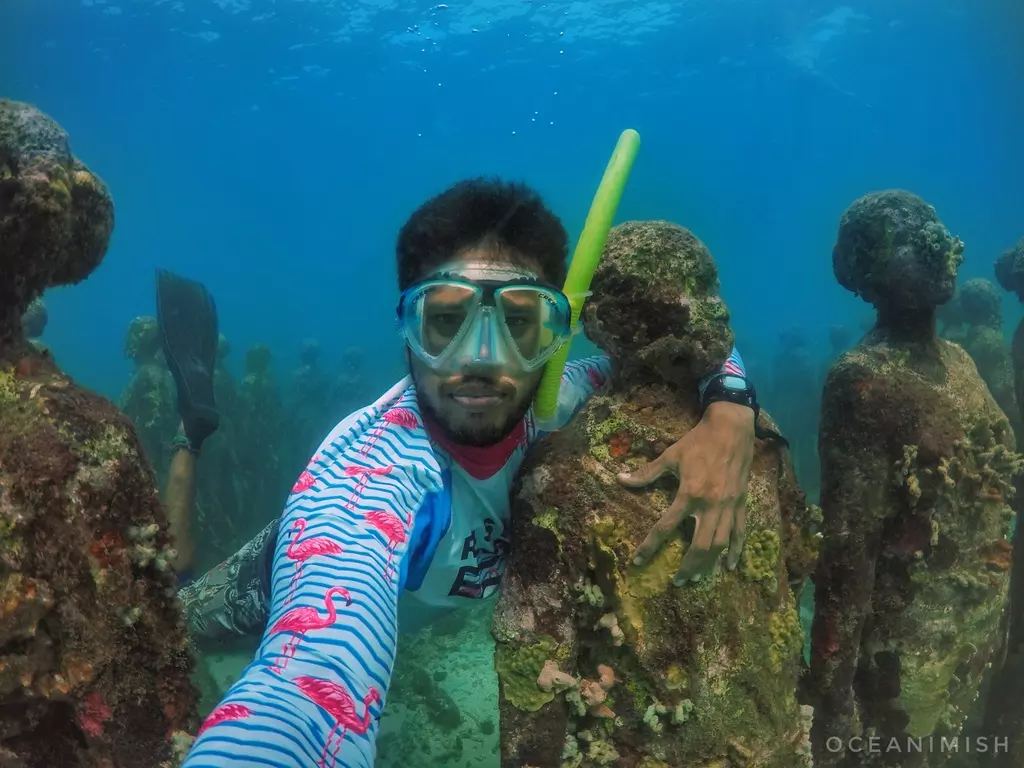 Underwater portrait among the sculptures of an underwater museum off the Caribbean coast